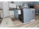 This modern kitchen offers sleek, black appliances and an island with plenty of storage space at 7515 Brattle Dr, Indianapolis, IN 46113