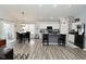 Bright kitchen features a dining area, an island with seating and sleek, modern appliances at 7515 Brattle Dr, Indianapolis, IN 46113