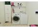 This laundry room features a washer, dryer, cabinets and shelving for all your needs at 7515 Brattle Dr, Indianapolis, IN 46113