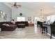 Spacious living room with vaulted ceiling, fan and comfortable furniture, perfect for relaxation at 7515 Brattle Dr, Indianapolis, IN 46113
