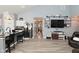 Open concept living room with vaulted ceilings, fan, and seamless flow into the adjacent dining area at 7515 Brattle Dr, Indianapolis, IN 46113