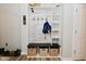 Convenient mud room area offers practical storage solutions and charming decorative accents at 7515 Brattle Dr, Indianapolis, IN 46113