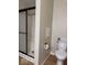 Bathroom featuring updated shower and white fixtures, including toilet at 7548 Briarstone Dr, Indianapolis, IN 46227
