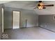 Bonus room featuring neutral walls, carpeted floor, white door and trim, and a ceiling fan at 7548 Briarstone Dr, Indianapolis, IN 46227