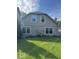 Home exterior featuring a lush green lawn and neutral colored siding at 7548 Briarstone Dr, Indianapolis, IN 46227