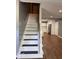 Open stairway and entryway that provides direct access to the kitchen at 7548 Briarstone Dr, Indianapolis, IN 46227