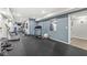 Spacious basement gym with rubber flooring, fitness equipment and mirrors at 790 Foxboro Dr, Avon, IN 46123