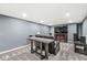 This finished basement features comfortable seating and a large television at 790 Foxboro Dr, Avon, IN 46123