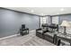 Finished basement with leather recliners, end tables and neutral carpeting at 790 Foxboro Dr, Avon, IN 46123