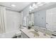 This charming bathroom has a shower-tub combo, vanity and soft lighting at 790 Foxboro Dr, Avon, IN 46123