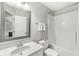 Well-lit bathroom featuring a vanity with a sink, decorative mirror, a toilet, and a shower/tub combo at 790 Foxboro Dr, Avon, IN 46123