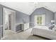 Light-filled bedroom boasts an ensuite bath, carpet, and vaulted ceilings at 790 Foxboro Dr, Avon, IN 46123