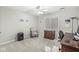 Neutral bedroom with ample space, a large window, a ceiling fan, and desk with views of the outdoors at 790 Foxboro Dr, Avon, IN 46123