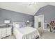Cozy bedroom features vaulted ceiling, carpet, two nightstands and an ensuite bathroom at 790 Foxboro Dr, Avon, IN 46123