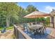 A spacious deck provides an ideal setting for outdoor dining with serene views of the backyard and surrounding nature at 790 Foxboro Dr, Avon, IN 46123