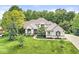 Beautifully landscaped two-story home with manicured lawn, mature trees, and brick facade at 790 Foxboro Dr, Avon, IN 46123