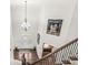 Grand two-story foyer with hardwood floors, staircase, chandelier and decorative door with glass insert at 790 Foxboro Dr, Avon, IN 46123