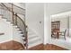 Elegant foyer with hardwood floors, curved staircase, and iron railing at 790 Foxboro Dr, Avon, IN 46123