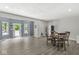 Open-concept living area with durable floors, a dining table, stainless steel appliances, and access to the backyard at 790 Foxboro Dr, Avon, IN 46123