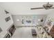 Open concept living room with large windows, fireplace, and neutral tones at 790 Foxboro Dr, Avon, IN 46123