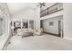 Spacious living room with high ceilings, large windows, and comfortable seating at 790 Foxboro Dr, Avon, IN 46123