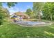 A beautiful backyard features a large pool and a deck perfect for outdoor entertaining and enjoying the summer sun at 790 Foxboro Dr, Avon, IN 46123