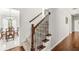 Carpeted staircase with wood railing leading to the upper level of the home at 790 Foxboro Dr, Avon, IN 46123