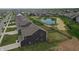 View of a home's backyard that has a fence and a pond at 808 Capricorn Dr, Franklin, IN 46131