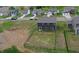 A home's backyard with a fence. The grass area is adjacent to a dirt patch at 808 Capricorn Dr, Franklin, IN 46131
