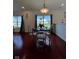 Cozy dining area with decorative lighting and a view of the outdoors through large windows at 808 Capricorn Dr, Franklin, IN 46131