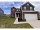 Charming brick and siding home with a two-car garage, complemented by landscaping in a front yard at 808 Capricorn Dr, Franklin, IN 46131