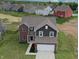 Beautiful home with a brick and siding exterior, well-manicured lawn, and a two-car garage at 808 Capricorn Dr, Franklin, IN 46131