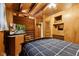 Cozy bedroom featuring wood paneling, vaulted ceilings, with a TV and stairway to the second floor at 8434 S Christian Dr, Nineveh, IN 46164