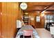 Charming dining area with wood paneling, providing a warm and inviting atmosphere for casual dining at 8434 S Christian Dr, Nineveh, IN 46164