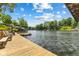 Beautiful view of a lake from the wooden dock, perfect for enjoying the scenery and sunshine at 8434 S Christian Dr, Nineveh, IN 46164