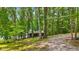 This cozy cabin retreat, nestled among towering trees, offers a peaceful escape into nature at 8434 S Christian Dr, Nineveh, IN 46164