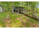 Cabin exterior with multiple decks and levels surrounded by lush greenery and mature trees at 8434 S Christian Dr, Nineveh, IN 46164