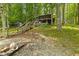 View of the cabin exterior with multiple decks, fire pit, and easy lake access at 8434 S Christian Dr, Nineveh, IN 46164