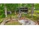 Charming cabin nestled among the trees, featuring an inviting deck and outdoor fire pit at 8434 S Christian Dr, Nineveh, IN 46164