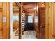 Hallway featuring wood paneling and a door with access to the exterior at 8434 S Christian Dr, Nineveh, IN 46164