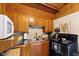 Classic kitchen with wood cabinets and practical appliances, providing a functional and tidy cooking environment at 8434 S Christian Dr, Nineveh, IN 46164
