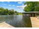 Tranquil lake view featuring a boat dock and clear water, ideal for boating and recreation at 8434 S Christian Dr, Nineveh, IN 46164