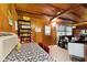 Inviting living room featuring wood paneling and comfortable seating, creating a cozy space for relaxation and entertainment at 8434 S Christian Dr, Nineveh, IN 46164