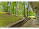 Multi-tiered stone patio overlooking the yard and wooded scenery at 8434 S Christian Dr, Nineveh, IN 46164