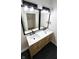 Contemporary bathroom with double sinks, quartz countertop, and modern lighting fixtures at 909 N Temple Ave, Indianapolis, IN 46201