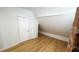 Bright bedroom features hardwood floors, closet space, and unique architectural details at 909 N Temple Ave, Indianapolis, IN 46201