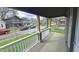View from the porch showing the neighborhood street with houses and parked cars at 909 N Temple Ave, Indianapolis, IN 46201