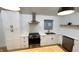 Close up of the kitchen with modern stainless steel appliances and quartz countertop at 909 N Temple Ave, Indianapolis, IN 46201