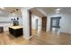 Open-concept space with hardwood floors, an exposed brick column, and abundant natural light at 909 N Temple Ave, Indianapolis, IN 46201