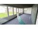 Enclosed sunroom featuring multiple windows providing ample natural light and outdoor views at 909 N Temple Ave, Indianapolis, IN 46201